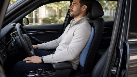 Driver sitting upright with lumbar support positioned at the natural curve of the lower back